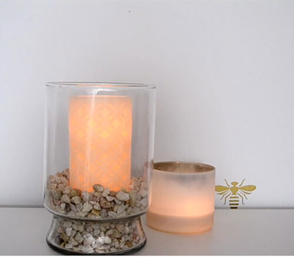 Inspired Ways to Repurpose Your Bloomaker Vases This Spring 4 vase with rocks and candle inside
